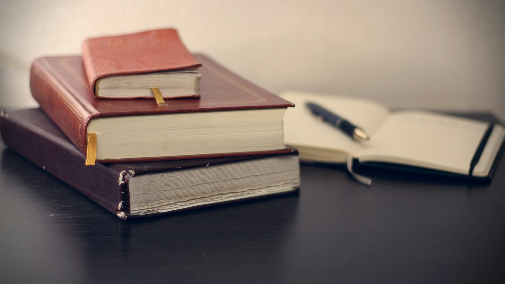 Law books and a notebook on a desk