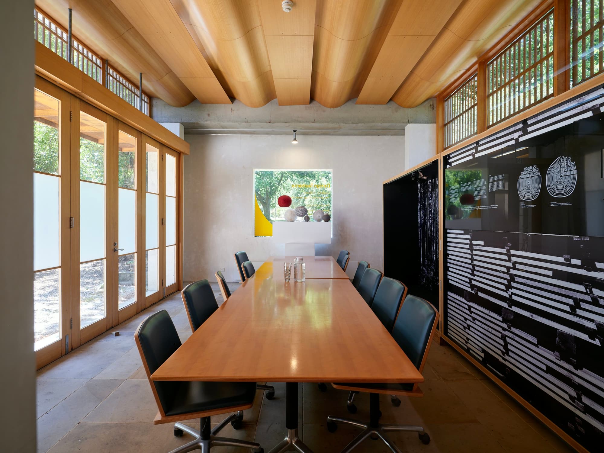 Modern conference room with a long wooden table
