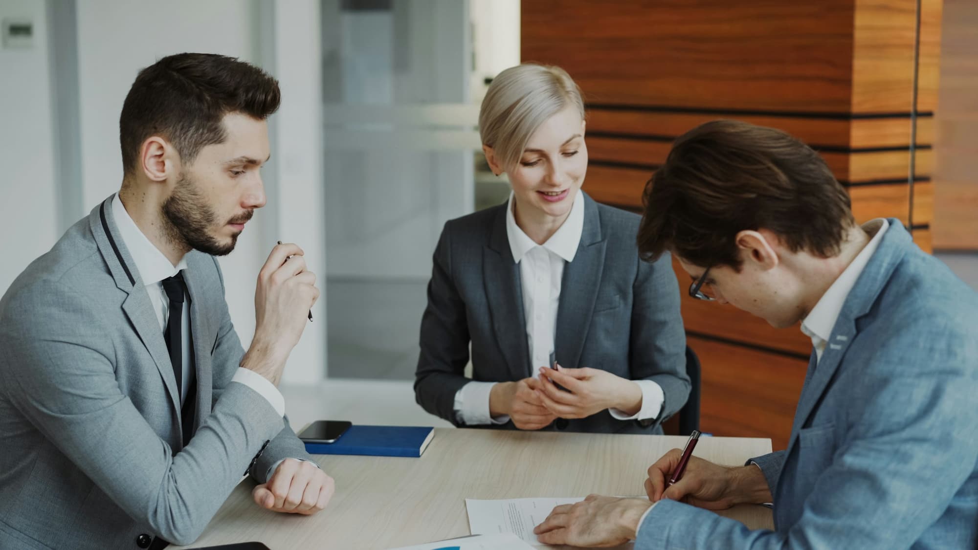 Lawyers reviewing a document together