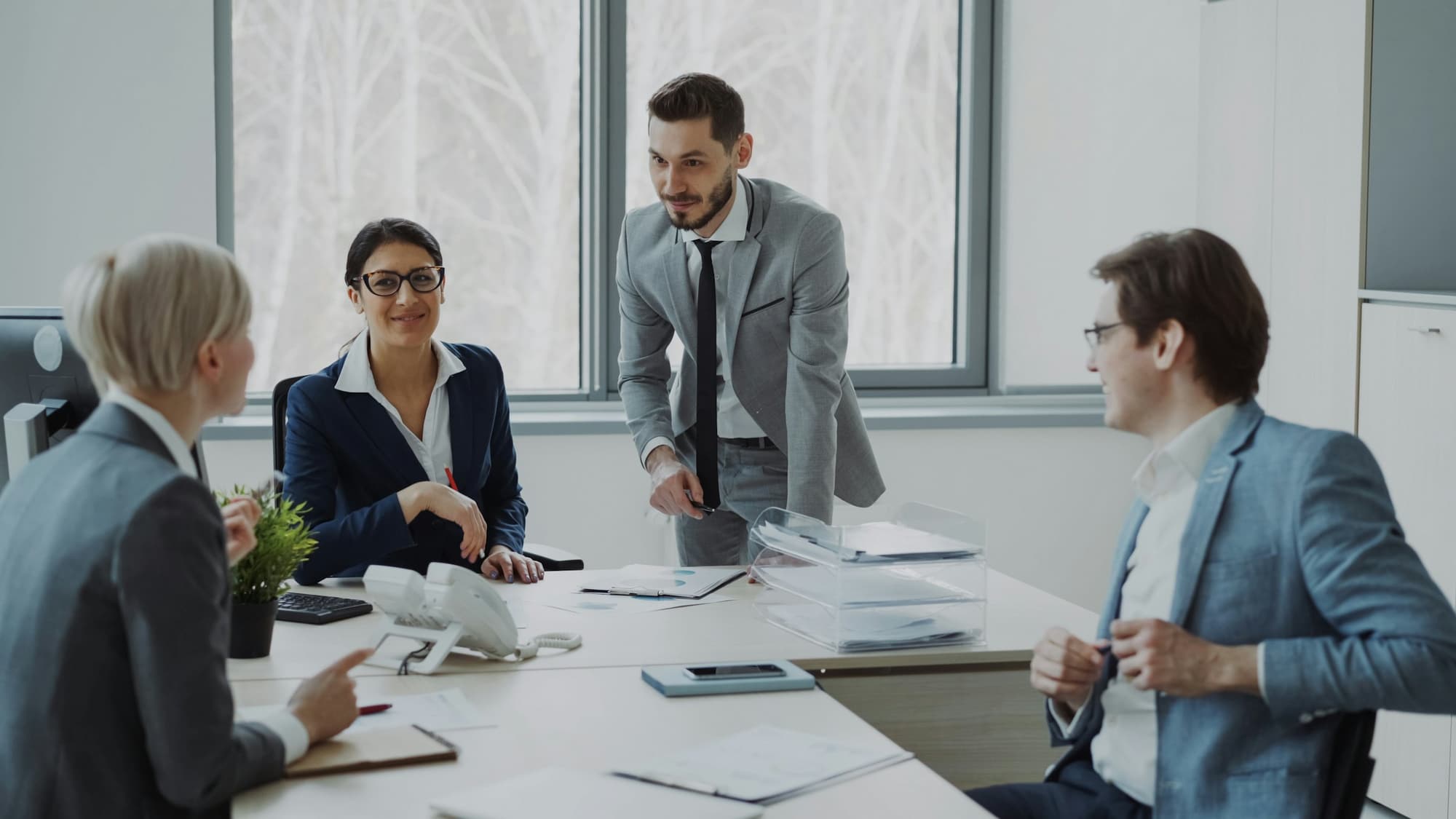 Professionals in a meeting around a conference table